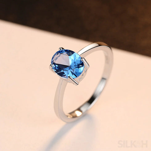 Oval Blue Topaz Sterling Silver Engagement Ring Una